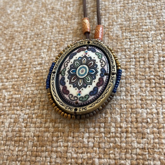FLASH SALE! $5 Ceramic pendant surrounded by beads on a leather strap. - Picture 2 of 3